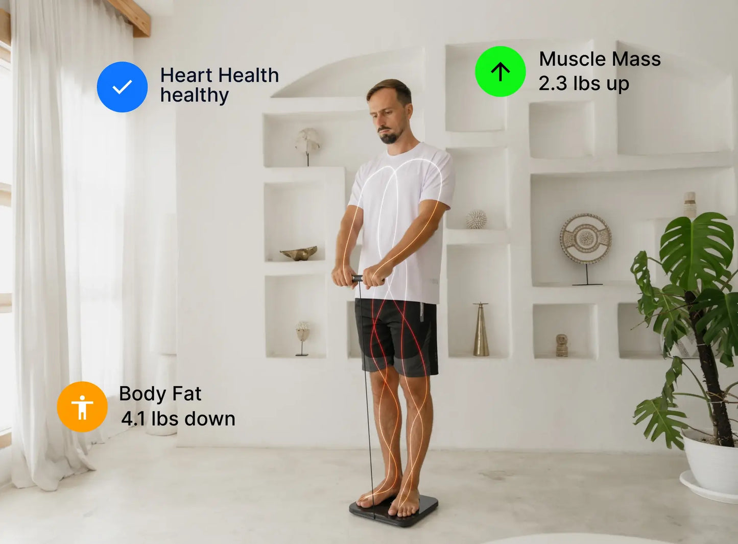 Man using a fitness tracker in a bright room with white walls and a plant.